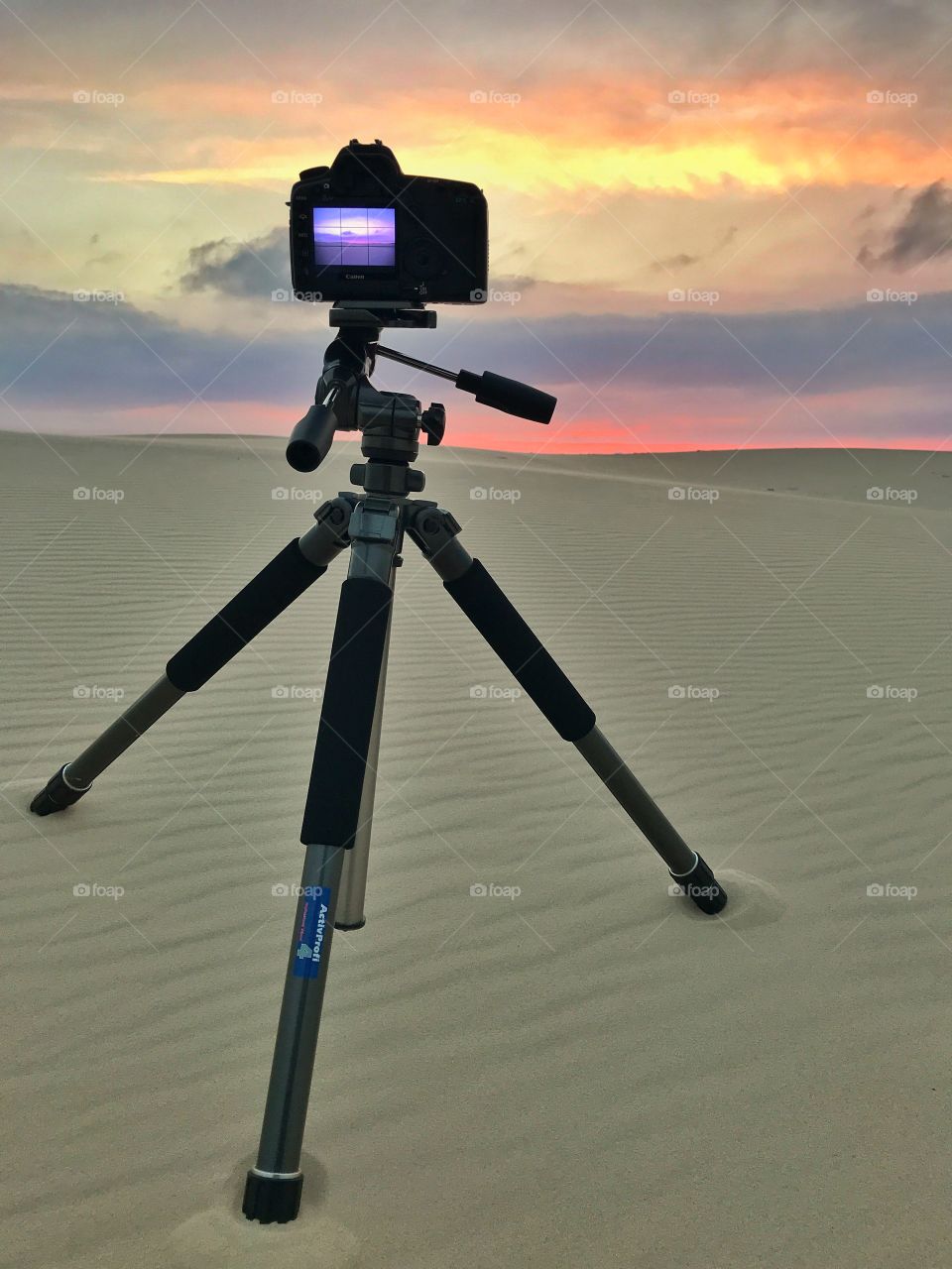 A beautiful warm summernight for taking photos. Warm sand and a lovely colorful sky