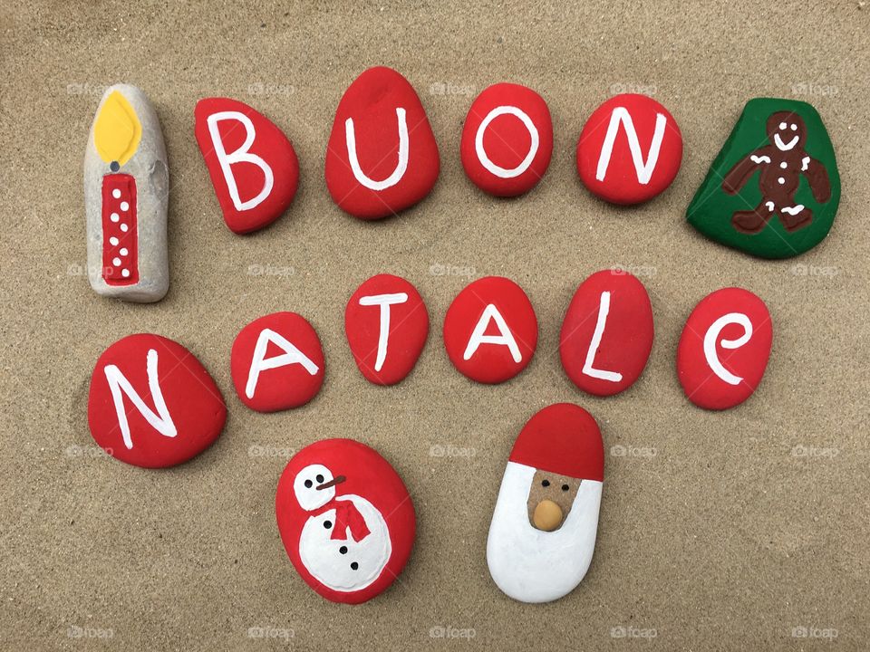 Buon Natale, italian Merry Christmas on colored stones