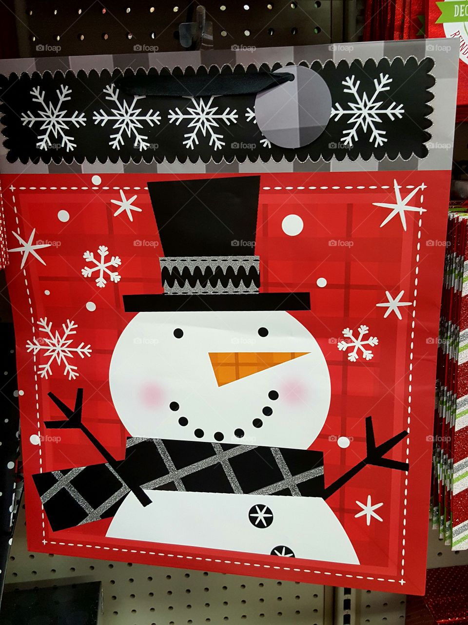 I just love snowmen - even when they're the face on a Christmas gift bag lol.