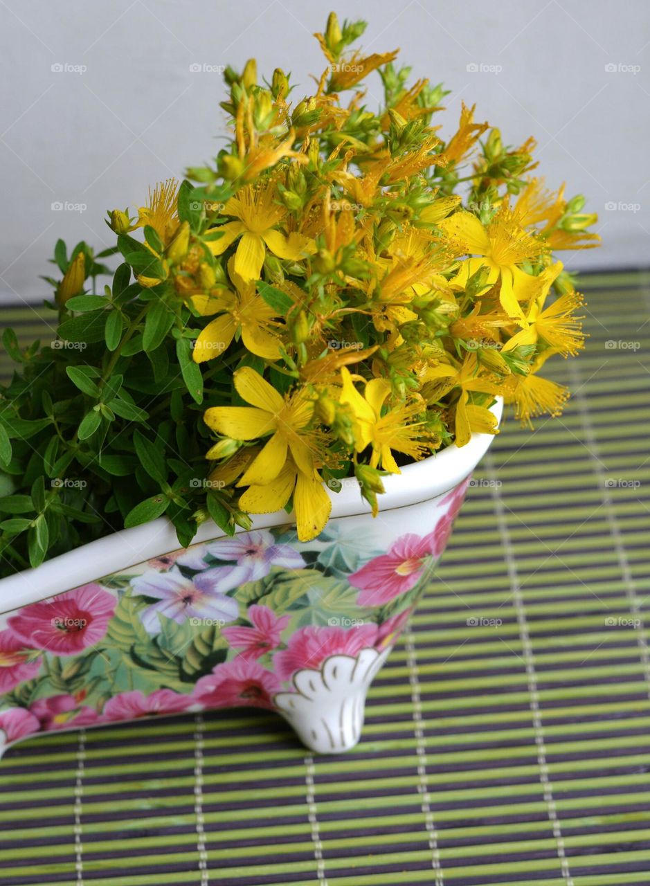 yellow flowers in vase summer time