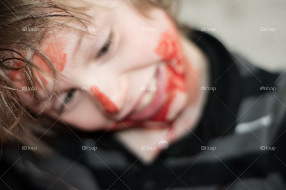 out of focus crazy zombie kid fake blood