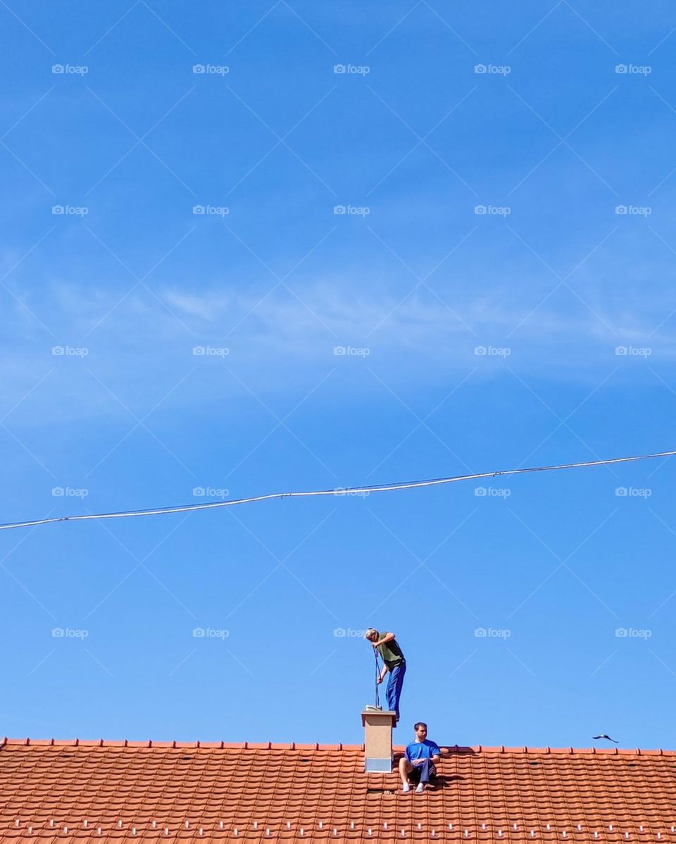 People working on a roof