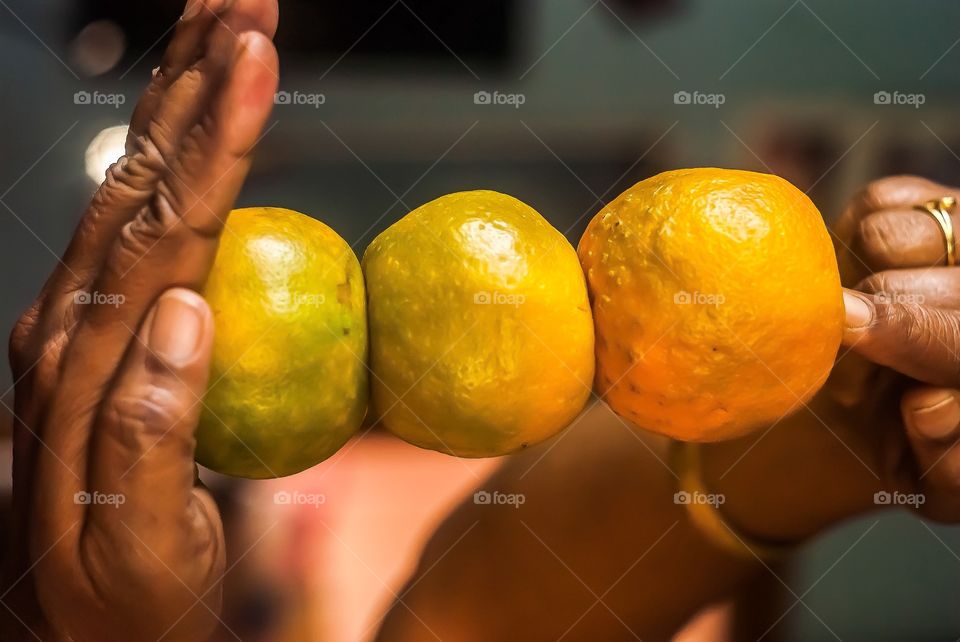 Person holding oranges