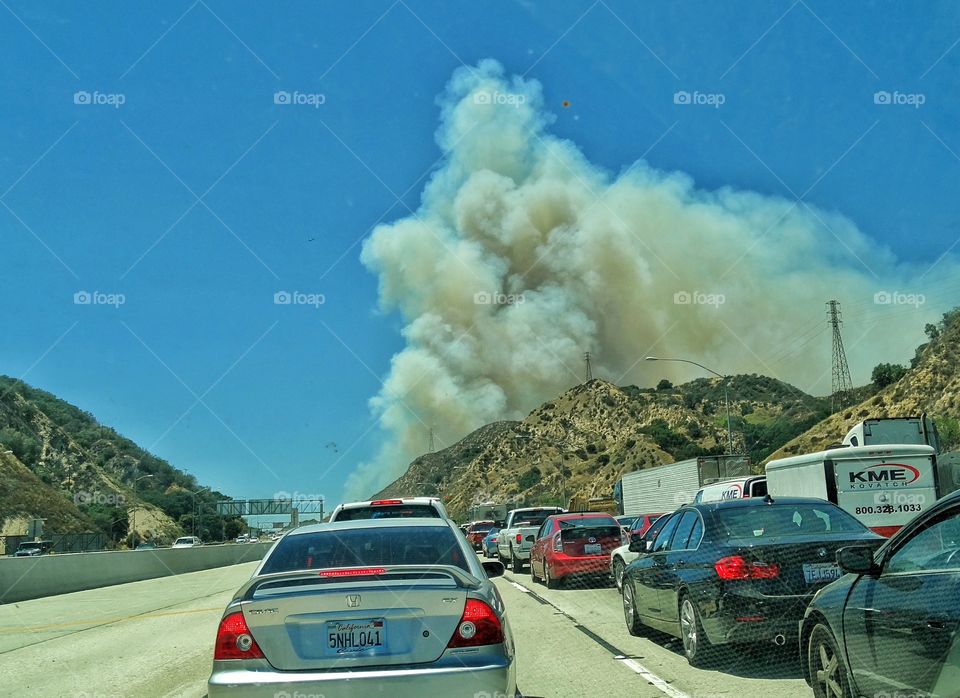 California Wildfire. Apocalyptic Plume Of Smoke Rising Over A California Freeway From A Summer Wildfire
