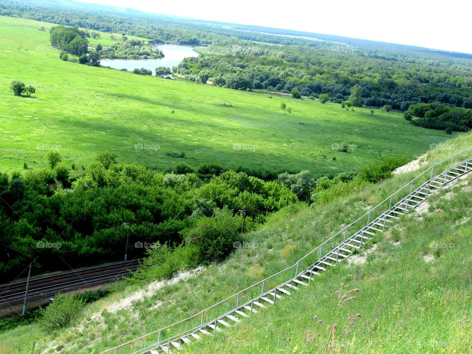 river, railway, stairs uphill, landscape of Russia