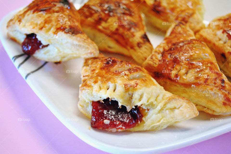 homemade glazed guava cheese strudel served in plate