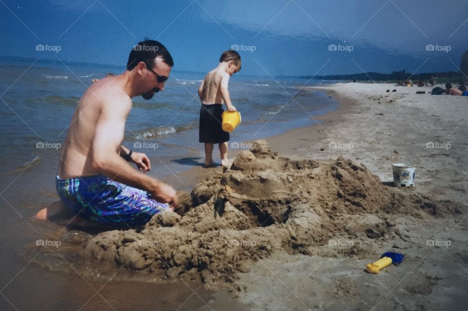 Father and Son Building Sand Castles