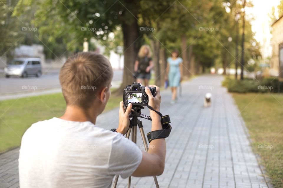 Photographer takes photos on the street 