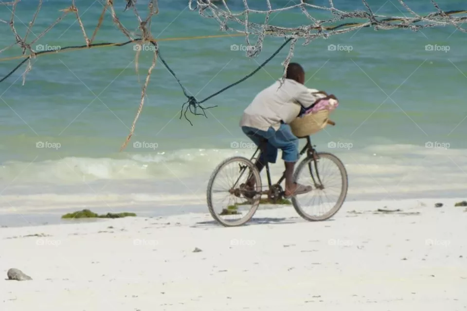 Zanzibar on his bicycle to was his washing