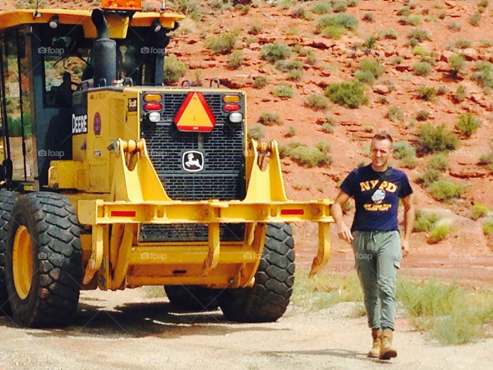 Man and John Deere machine
