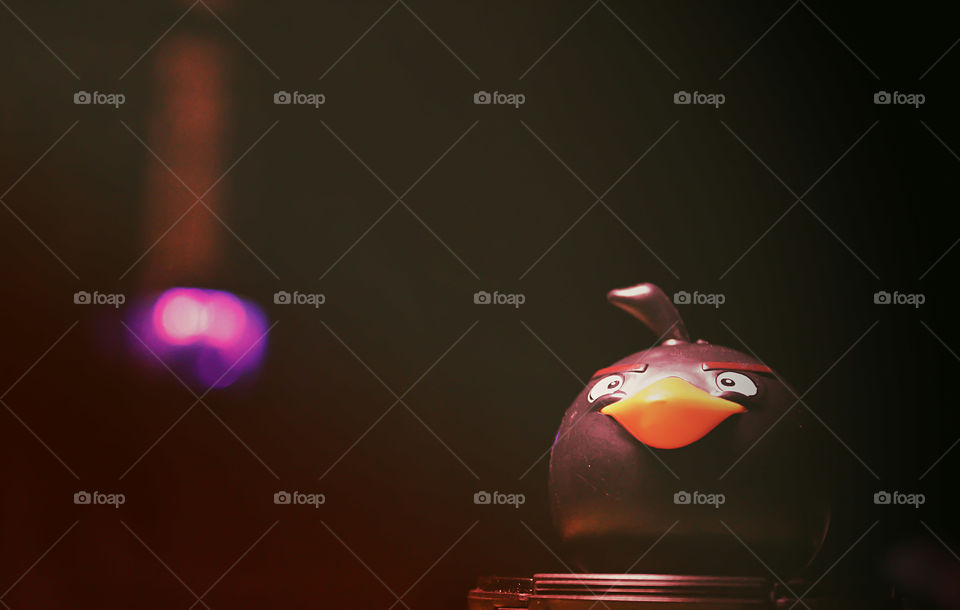 Low light object photography is always great. Angry bird gives a final touch with a background light .