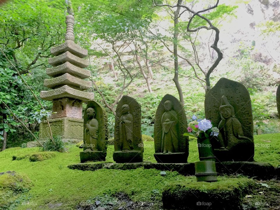 Stone carvings in the bamboo gardens of Hokokuji Temple in Kamakura.