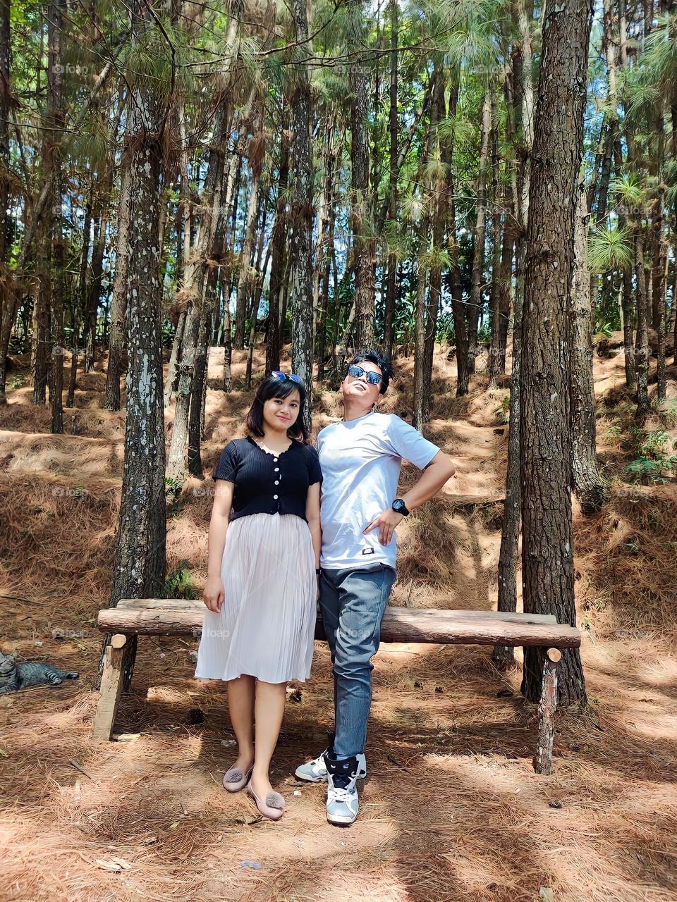 Portrait of a young couple on holiday in a pine forest area