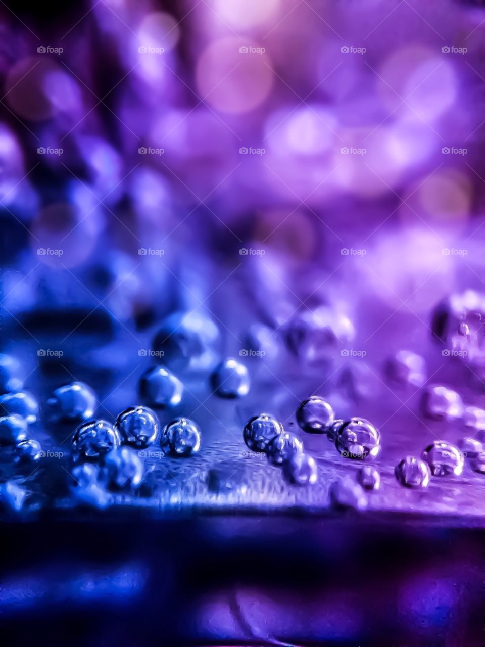 Bubbles on the blurred blue and purple background 