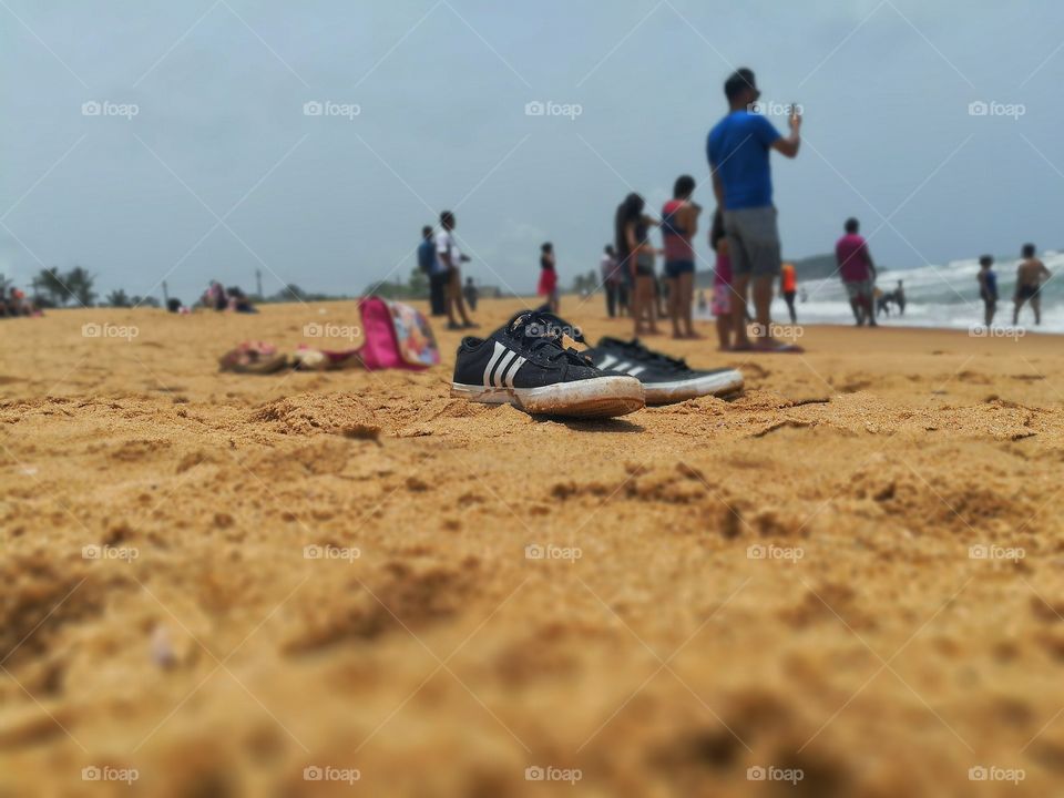 Something random with shoes at beach.