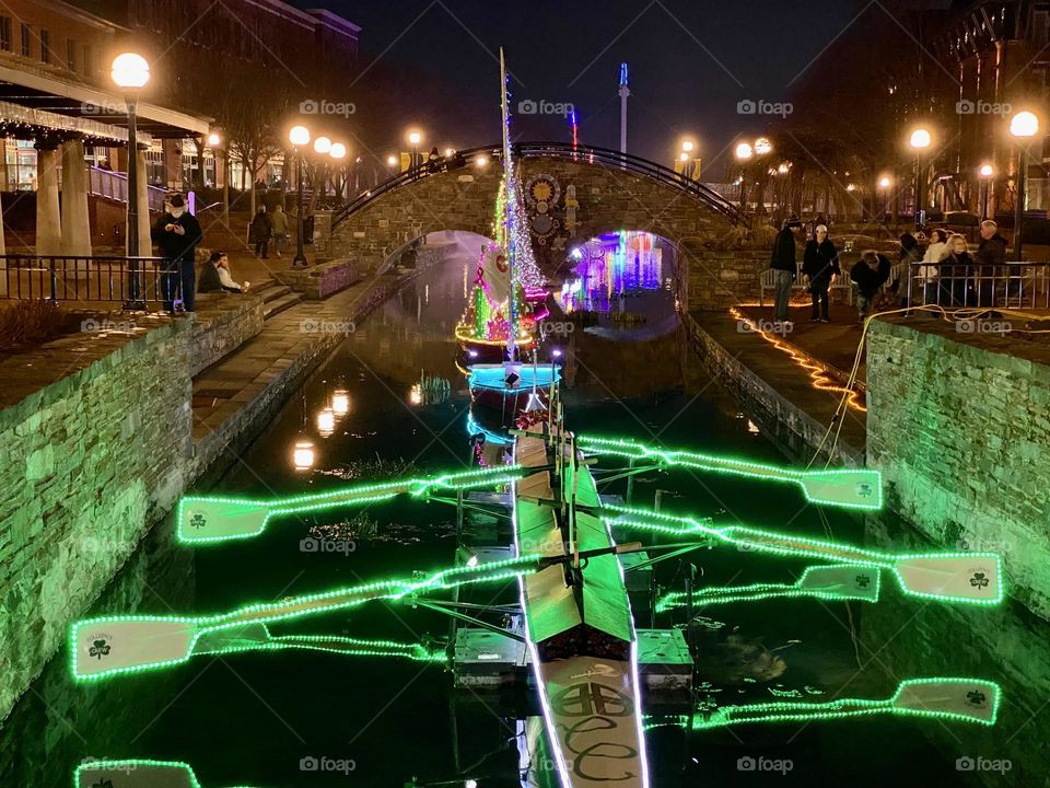 Illuminated model boats on a canal during an annual event in Frederick Maryland