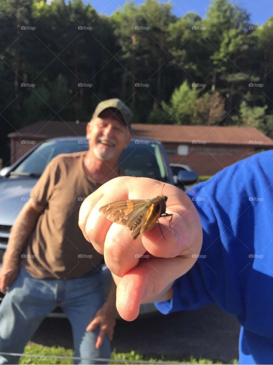 Friendly moth - happy man!