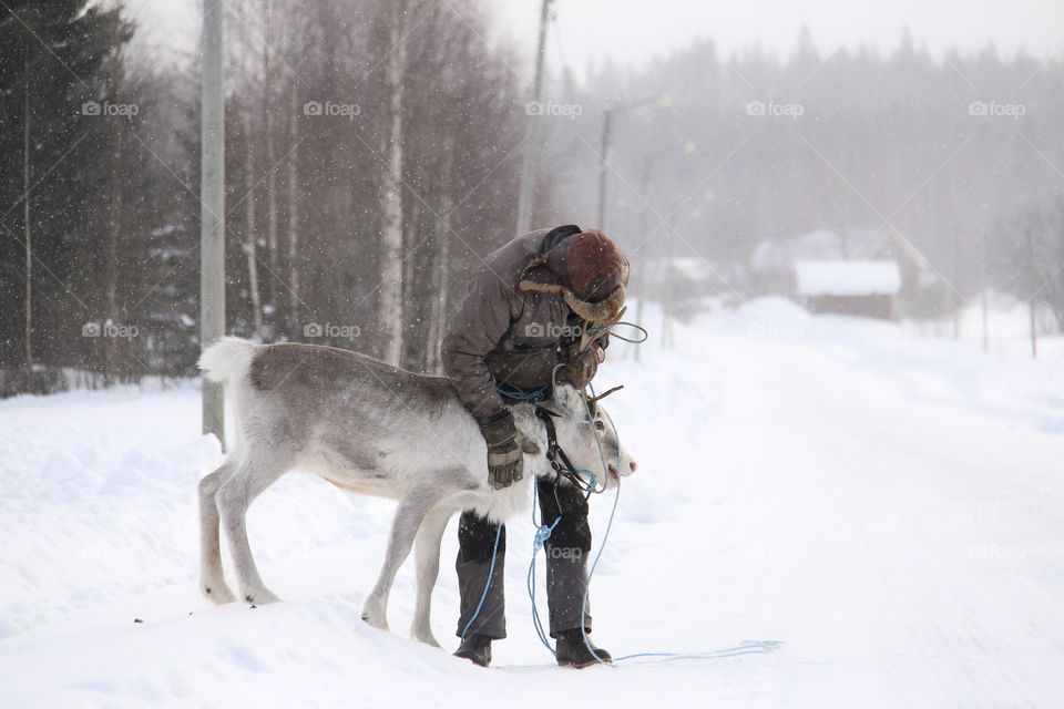 old man with reindeer