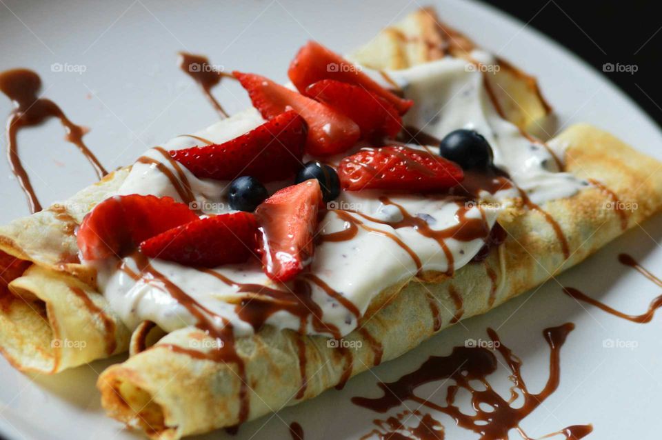 polish pancakes with fresh fruits and dubble cream