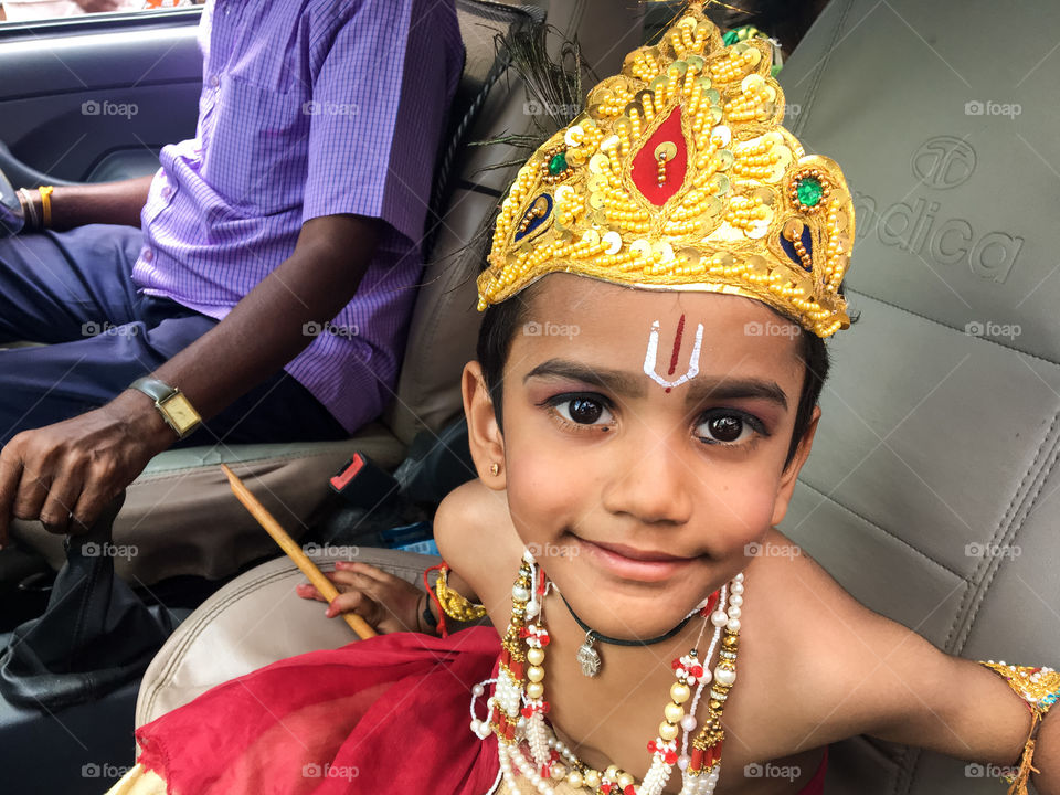 Baby boy dressed with jewels on a local festival 