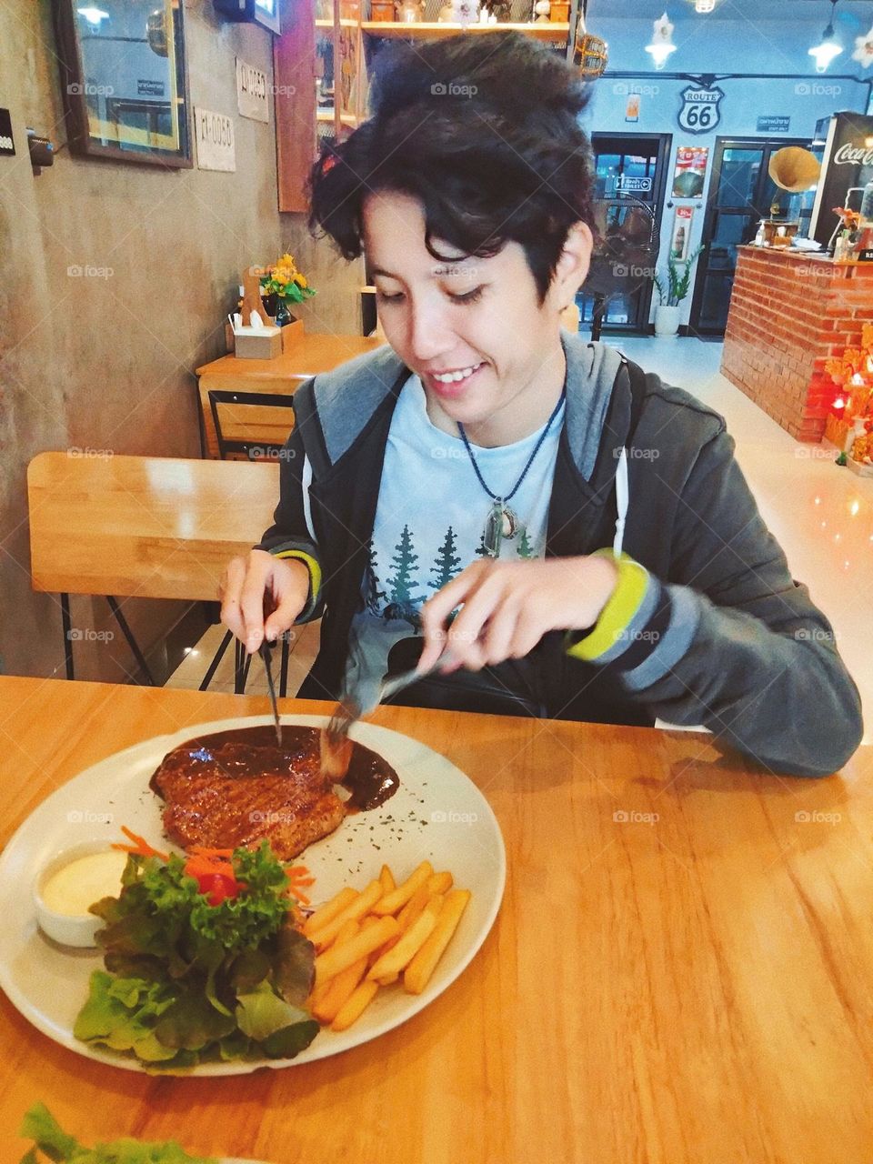 My boy friend is enjoying his favorite meal.