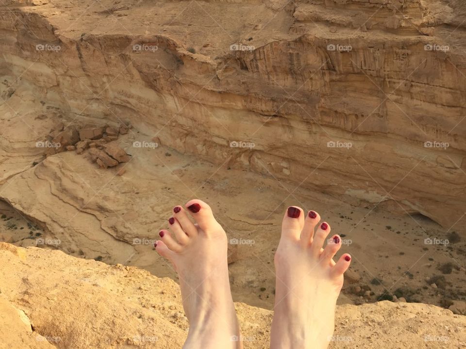 Feet on the desert background in Tunisia