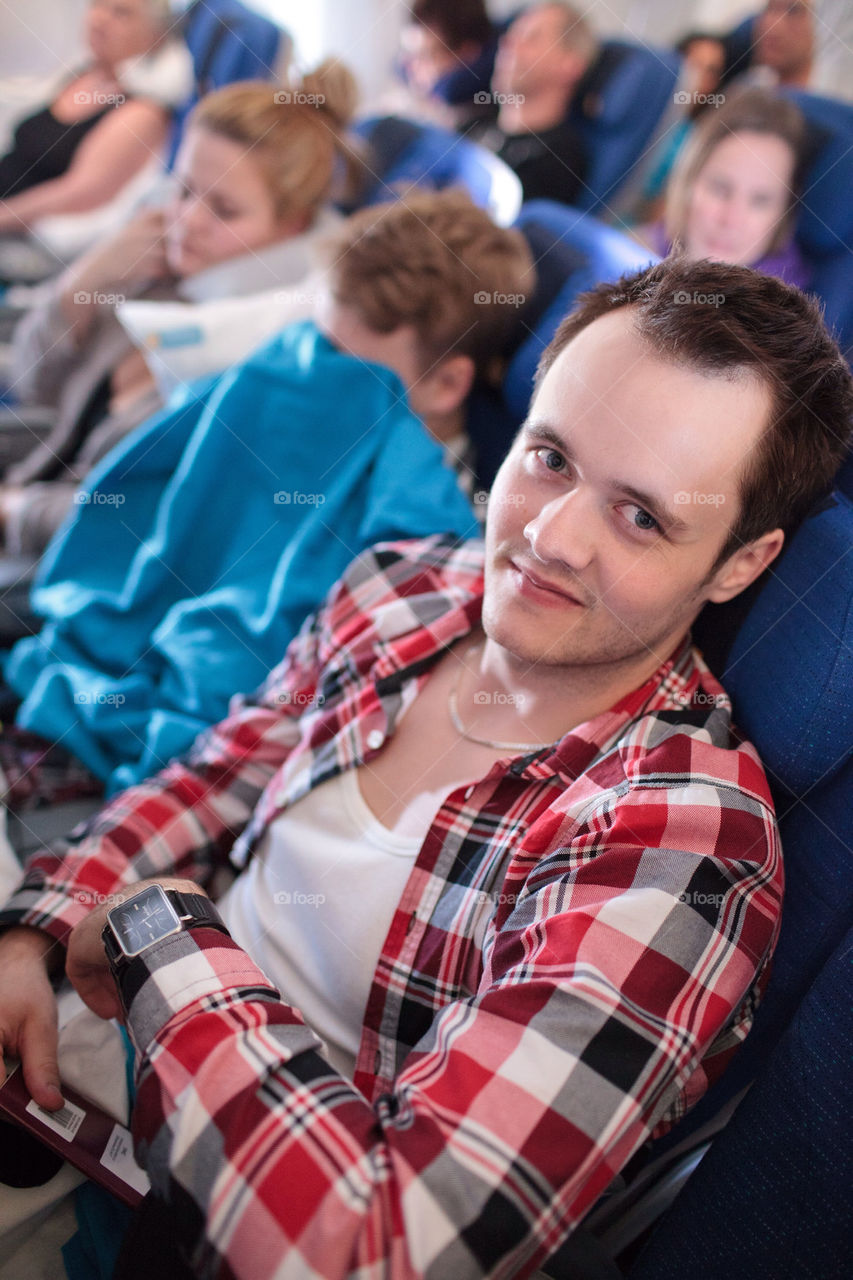Happy man on an airplane