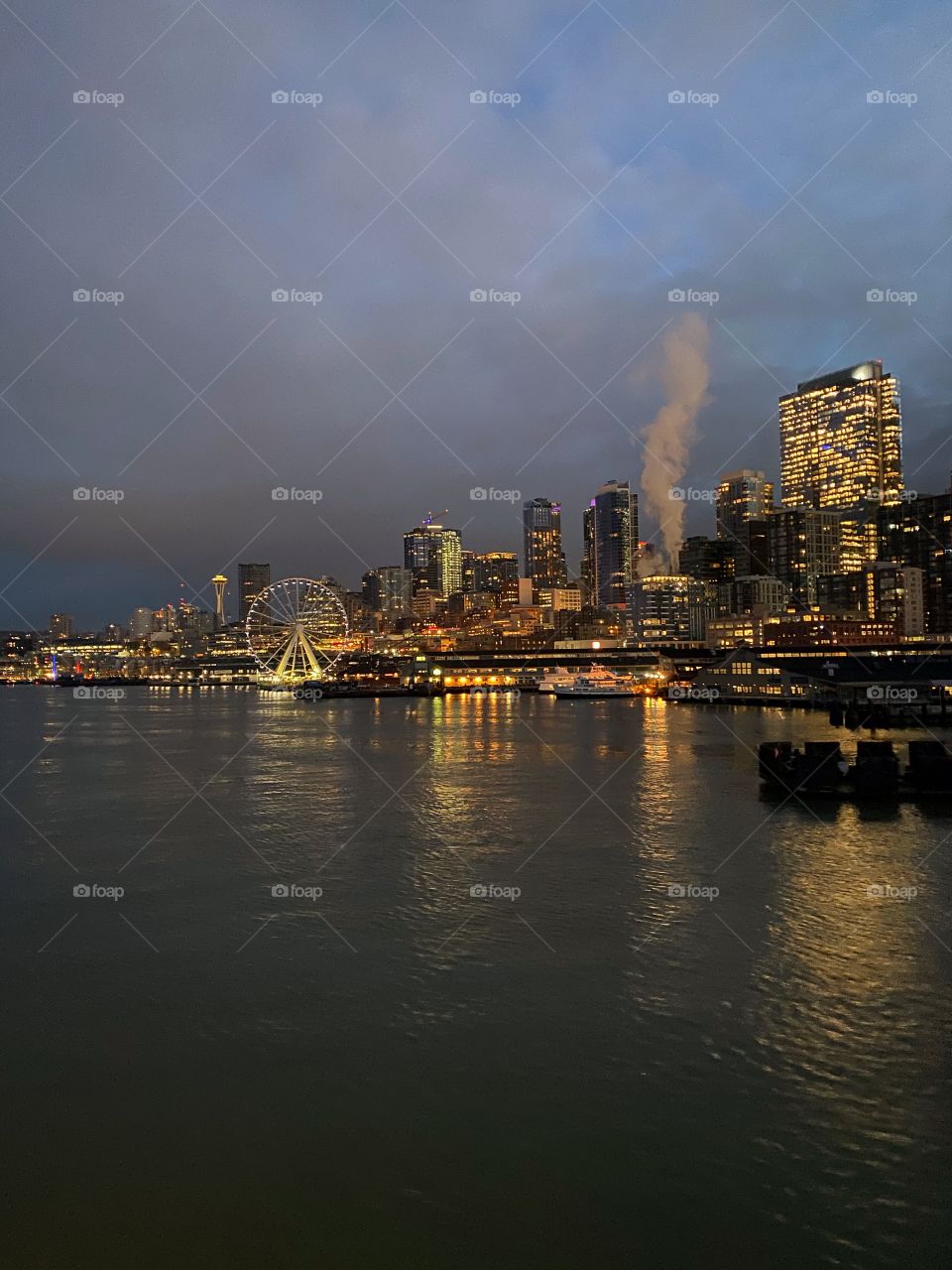 Seattle Waterfront showing the Great Wheel and Space Needle at sunrise