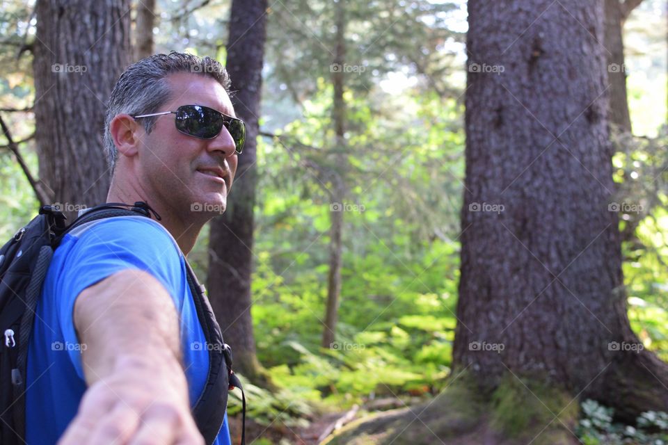 Mature man hiking in forest