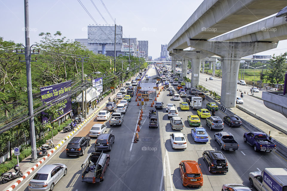Many cars on the road and the road is being repaired at Rattanathibet Nonthaburi Province Government Center page in Thailand. January 12, 2019