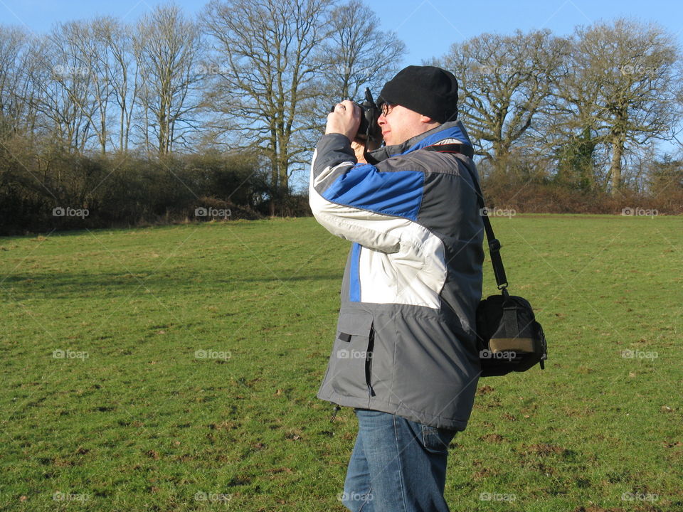 Man photographing with camera