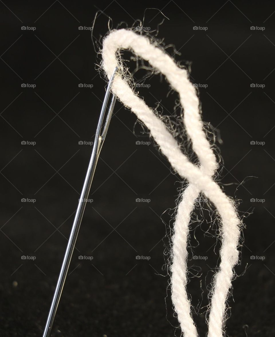 Macro image of needle and thread 