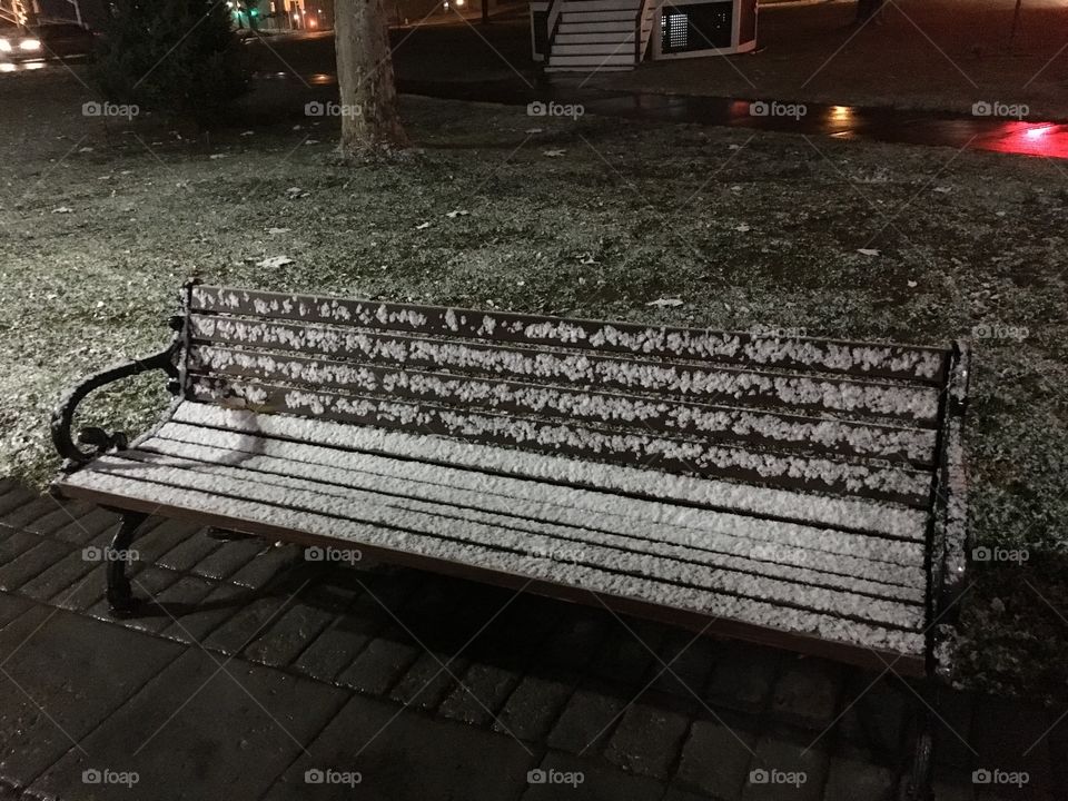 Park bench in snow 