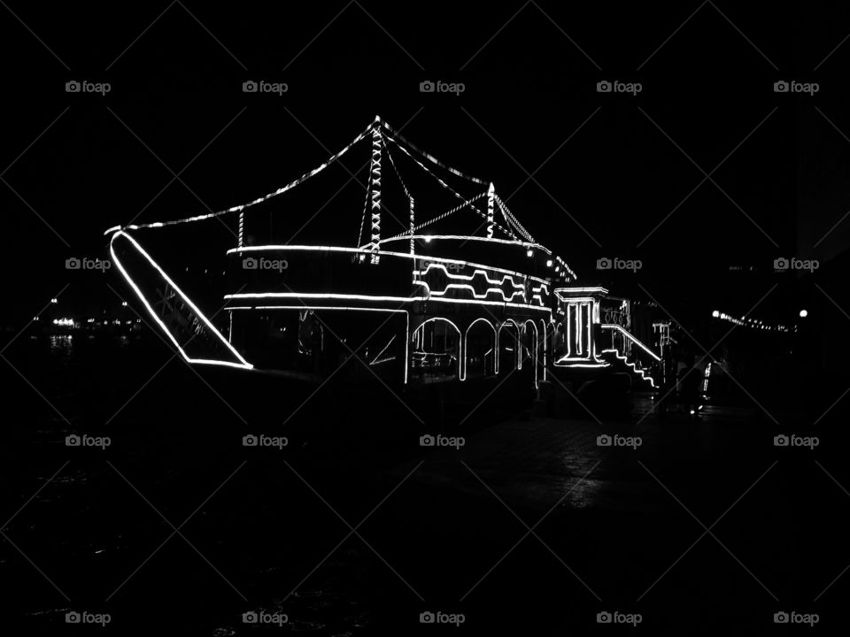 Dhow. Lit outline of a dhow in dubai on the creek