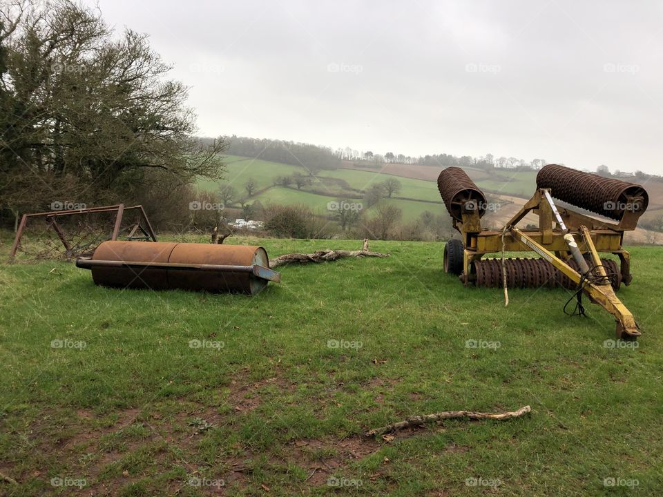 Here is the colored version of this size able farm machinery on display here in the countryside.