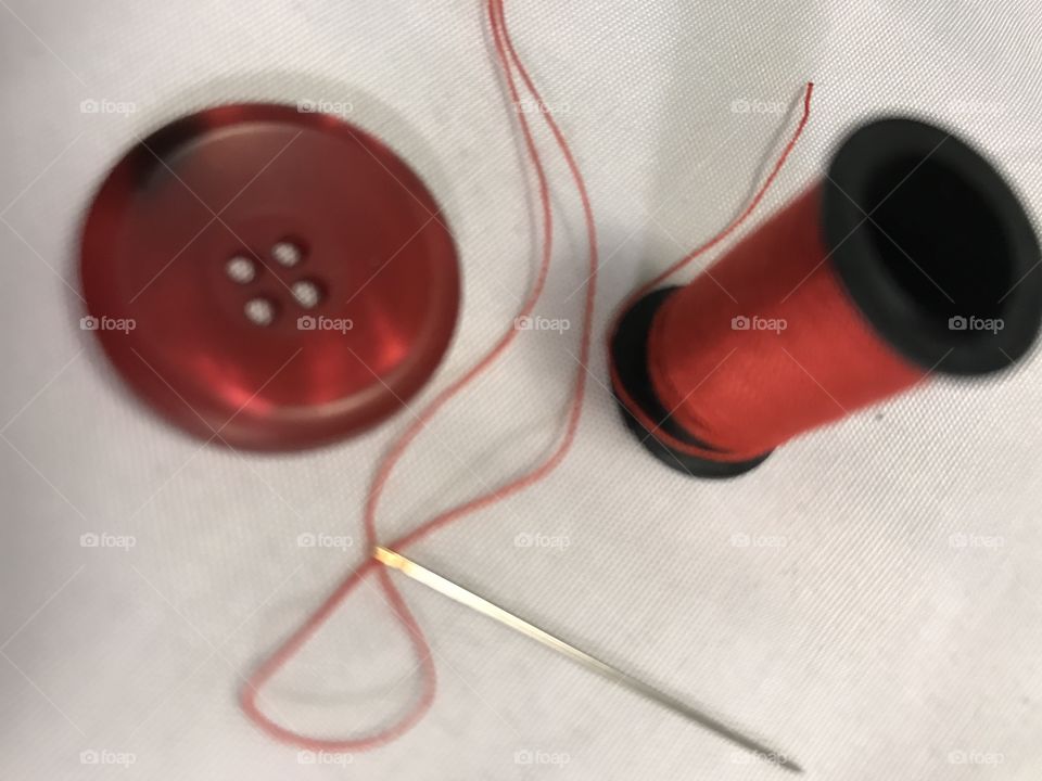 Red button and thread