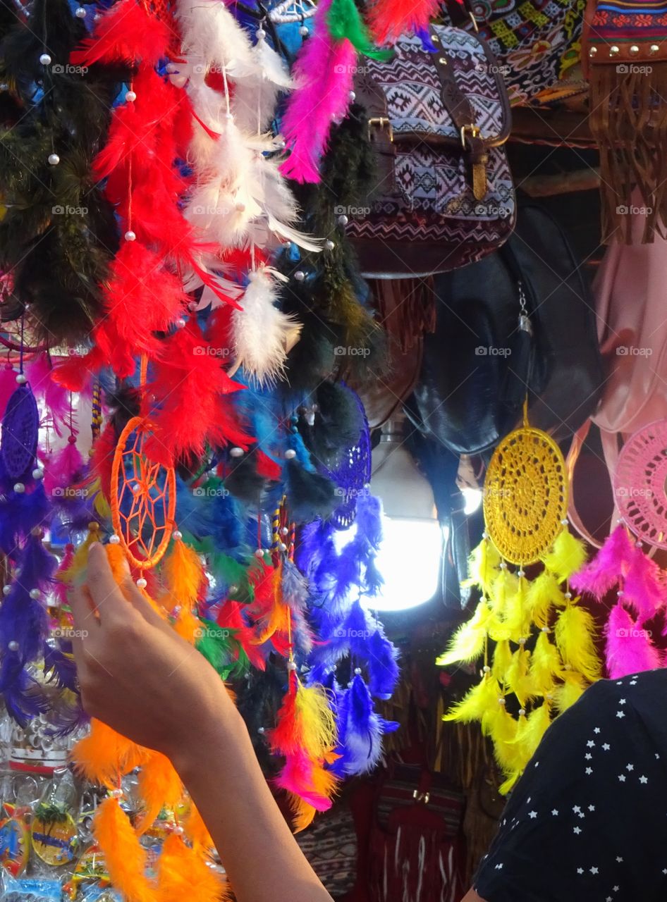 young woman doing window shopping in a flea market