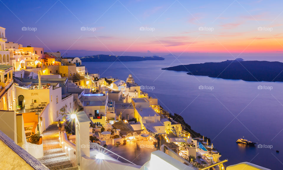 Illuminated town during sunset