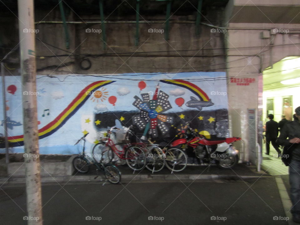 Shinjuku, Tokyo, Japan.  Colorful Street Art Mural and Bicycles.