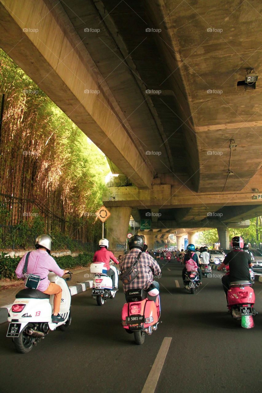 Ride a scooter around town, safe and fun.