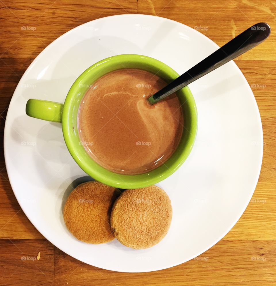 High angle view of coffee with cookie