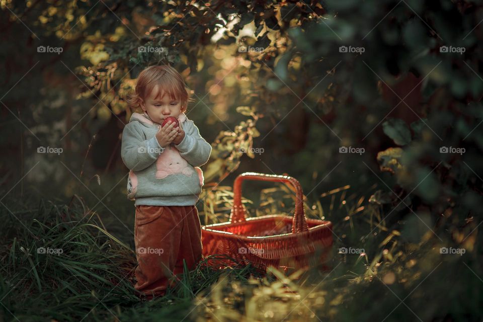 Little girl portrait with apple