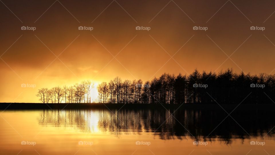 It was a perfect sunset with the perfect light at the perfect location. When it suddenly started raining, it made it look like fire in the sky.