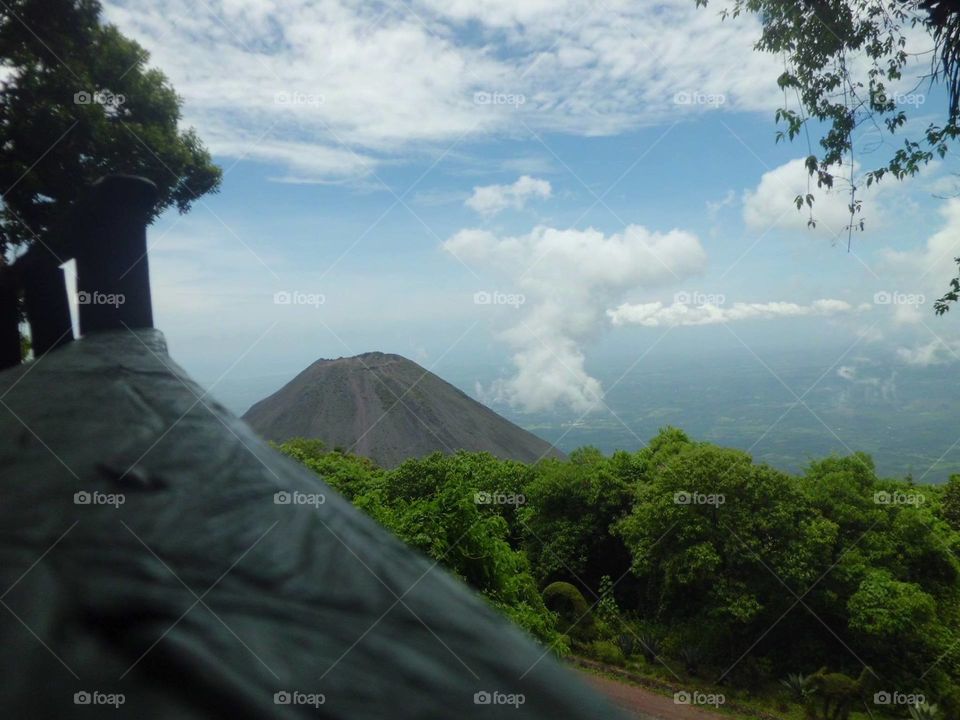 Scenic view of volcanic mountains and lush forest