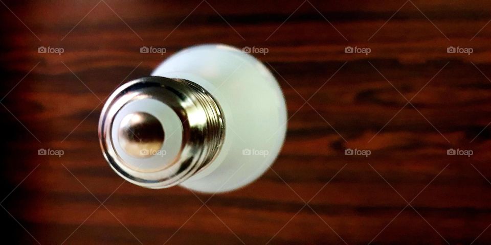 glass bulb with silver metal base, seen from another point of view.