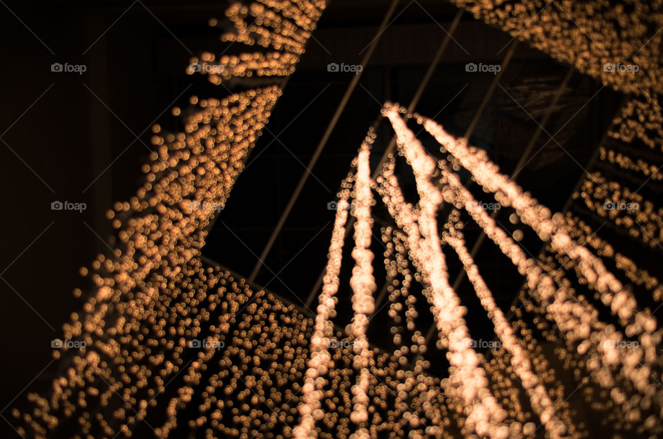I was wandering in a shopping mall and found this wonderful golden chandelier in the middle of the atrium.