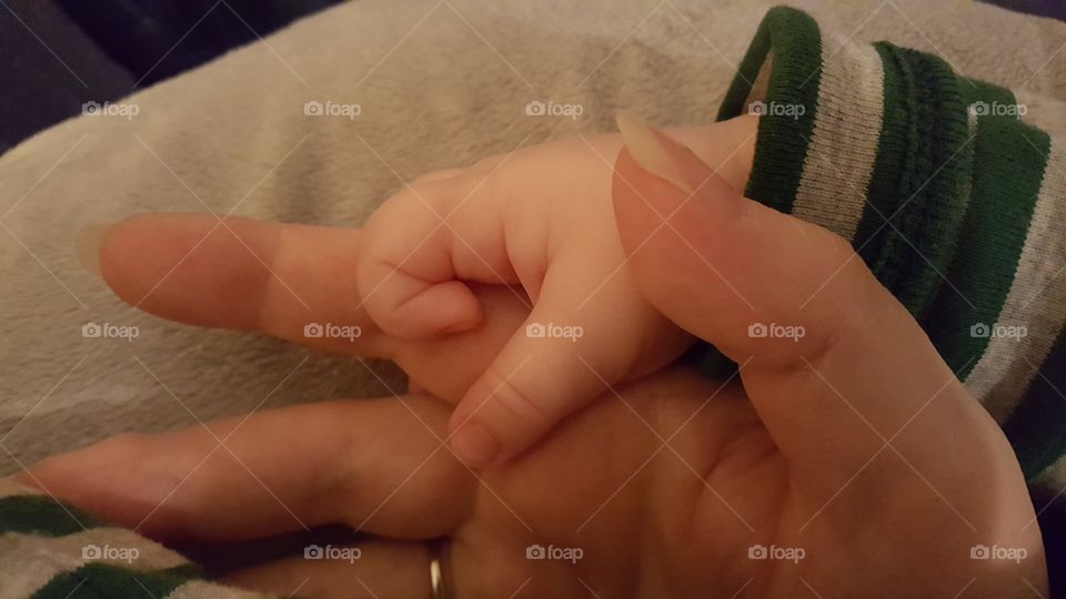 mama holding baby's hand