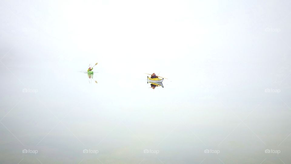 kayaks in the fog
