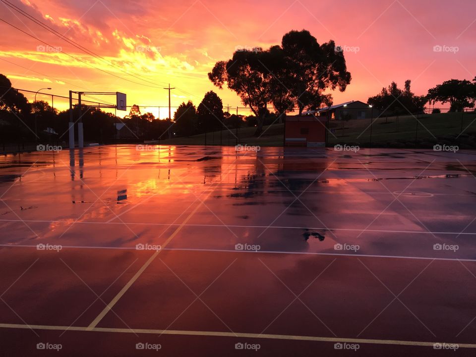 Sunset over basketball courts