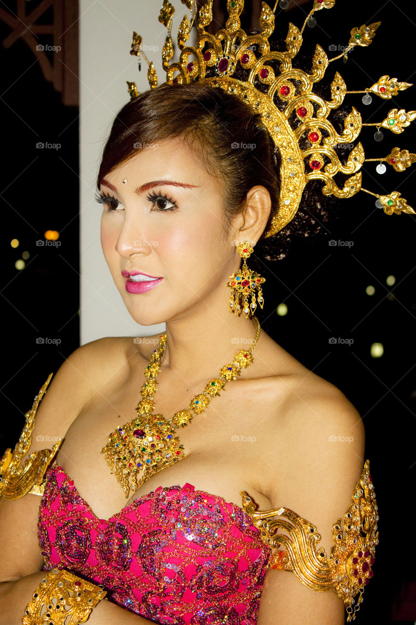 Thai lady wearing crown and jewelry gold 